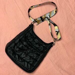 Elegant Black Crossbody Bag with Patterned Strap